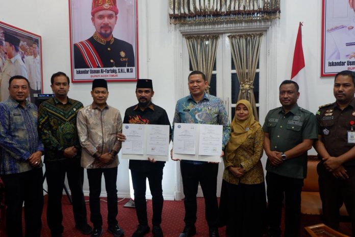 Penandatanganan nota kesepakatan ULT P4GN antara BNNP Aceh dan Pemkab Aceh Timur.